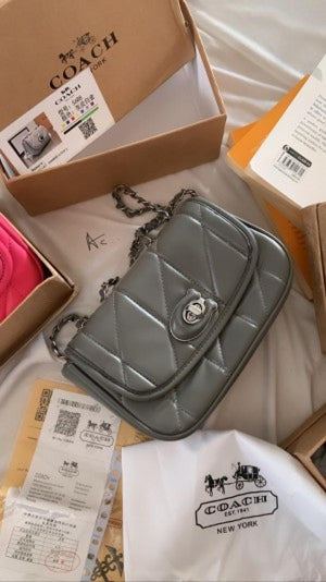 COACHH Tabby Pillow Mini Premium Quality with OG Box (Scentiq)AV088